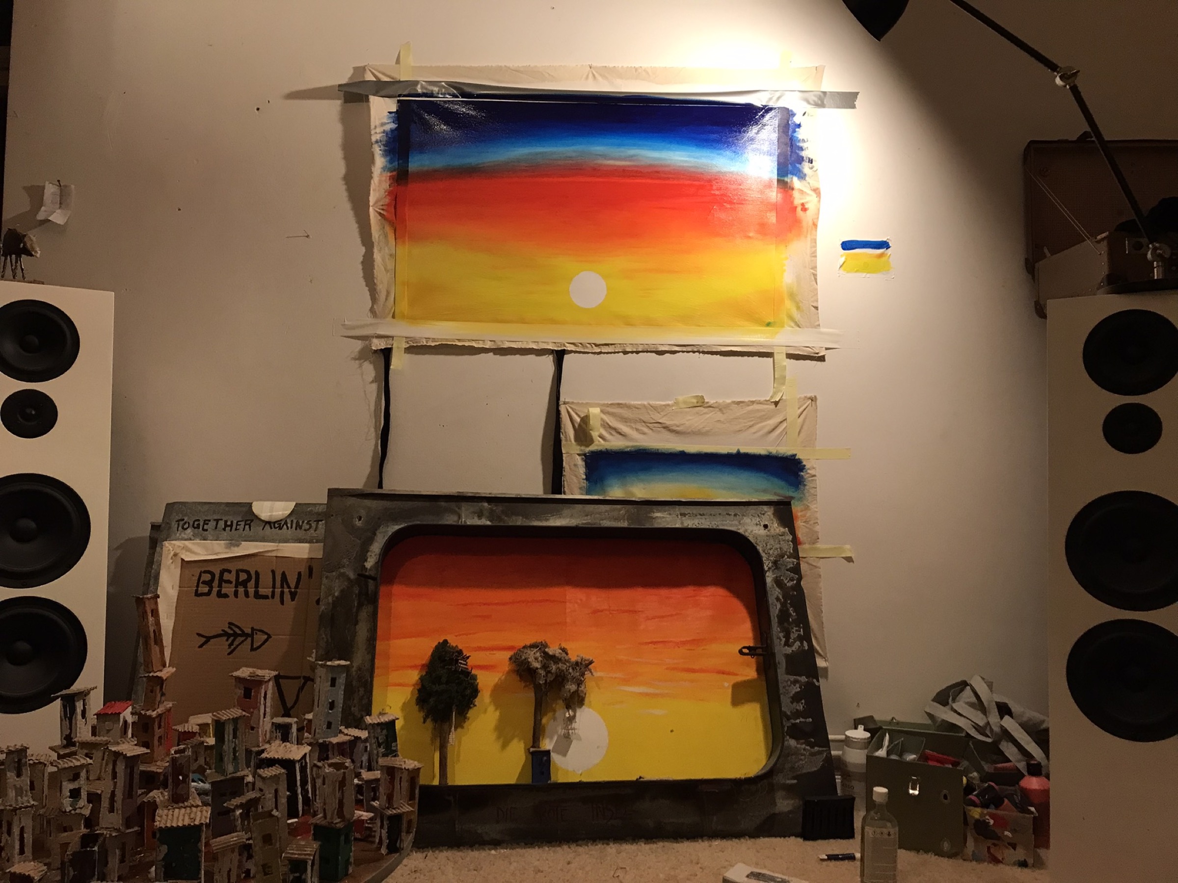 Cardboard houses being plastered