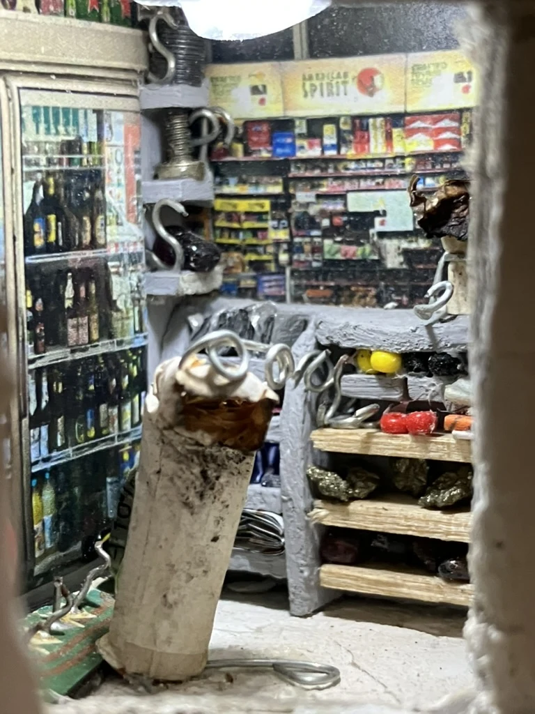 Cigarette seller behind the counter in the Kotti Späti