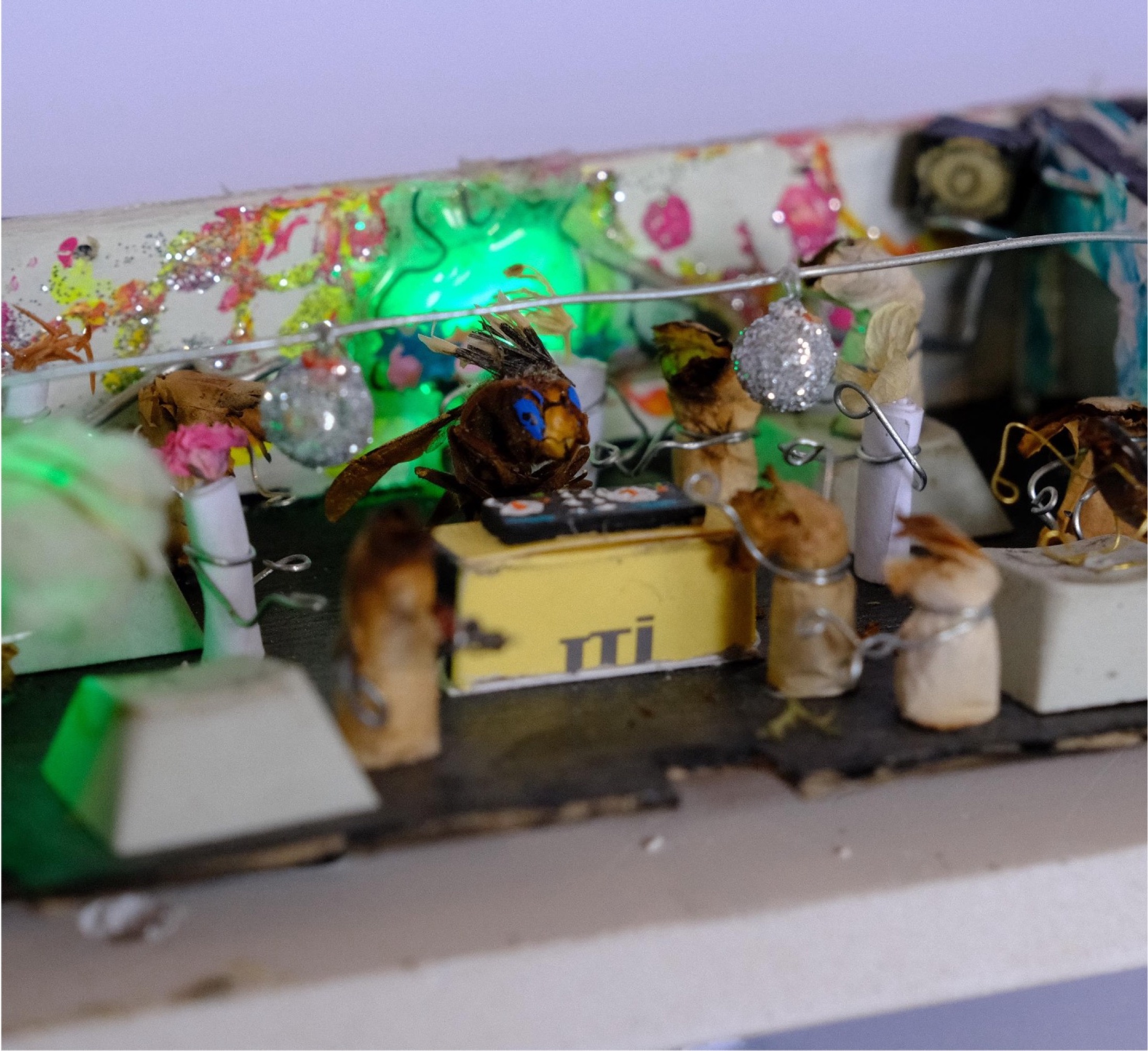 Wasp like insect creature at the miniature DJ booth