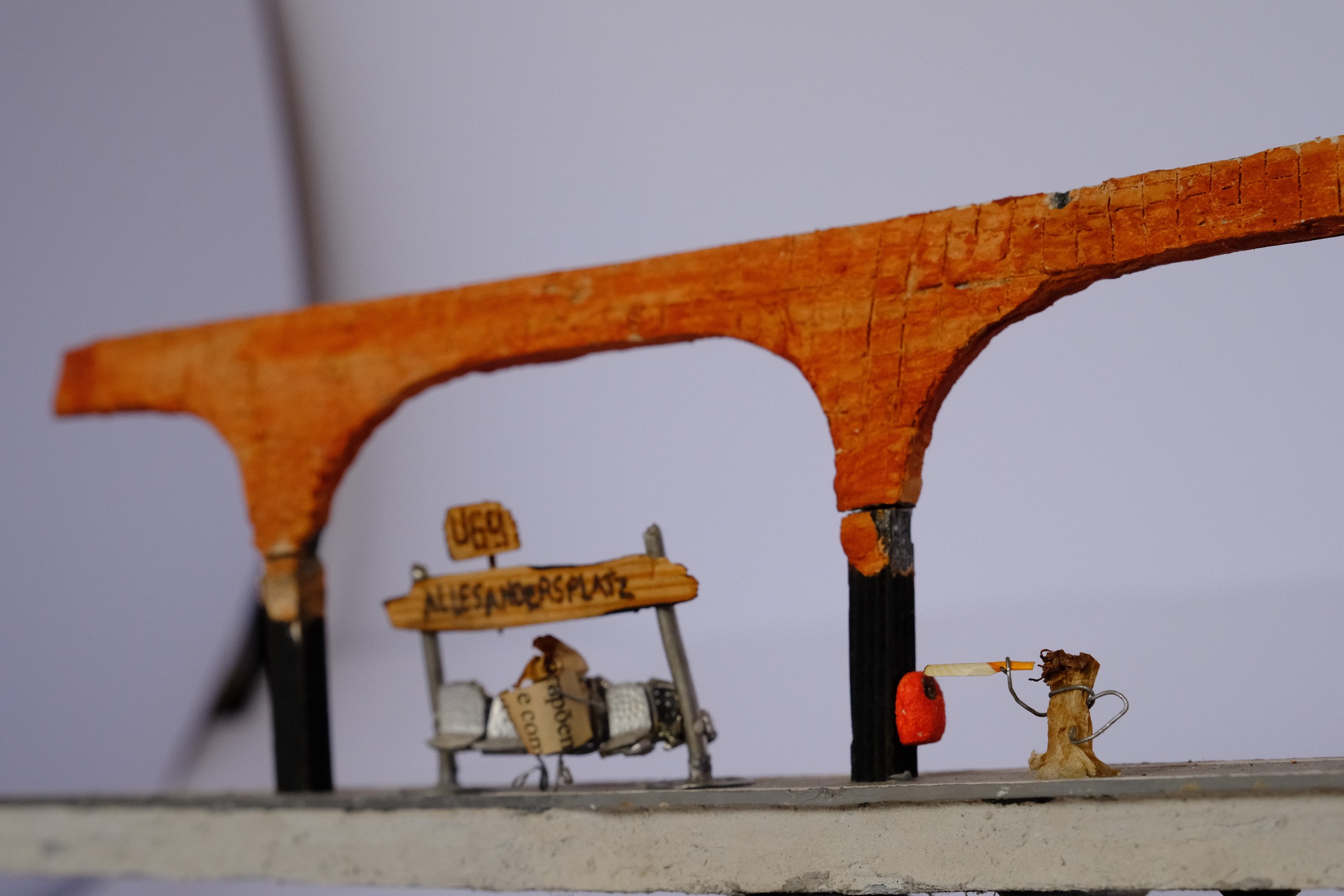Cigarette figure smoking at the miniature station